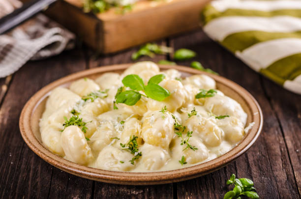 istock Cheese gnocchi with blue cheese sauce and galic 942234756