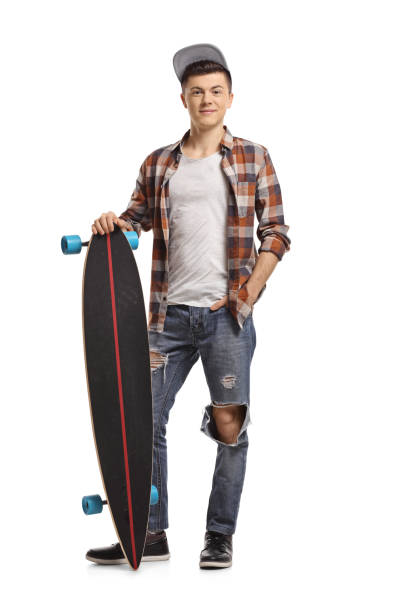 istock Teenage hipster with a longboard 942234980