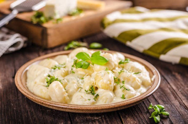 istock Cheese gnocchi with blue cheese sauce and galic 942237202