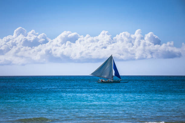 istock One double outrigger sailboat on the sea 942237368