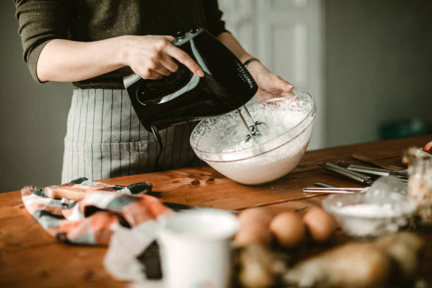 Young hous wife mixing wiped cream