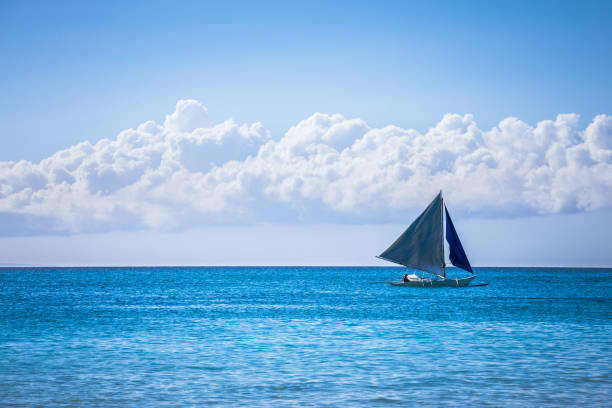 istock One double outrigger sailboat on the sea 942237818