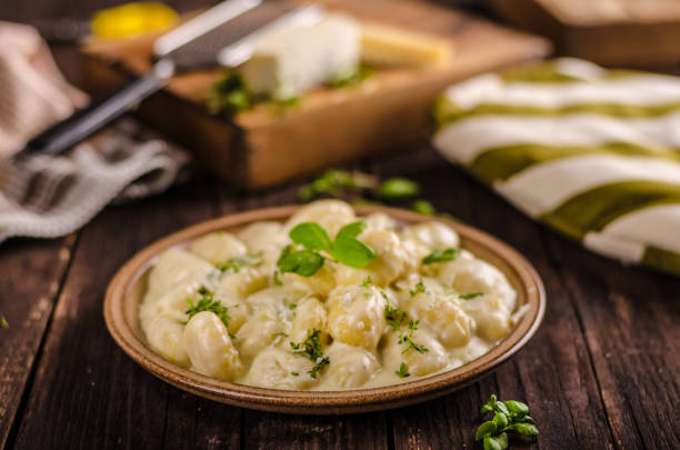 istock Cheese gnocchi with blue cheese sauce and galic 942238152