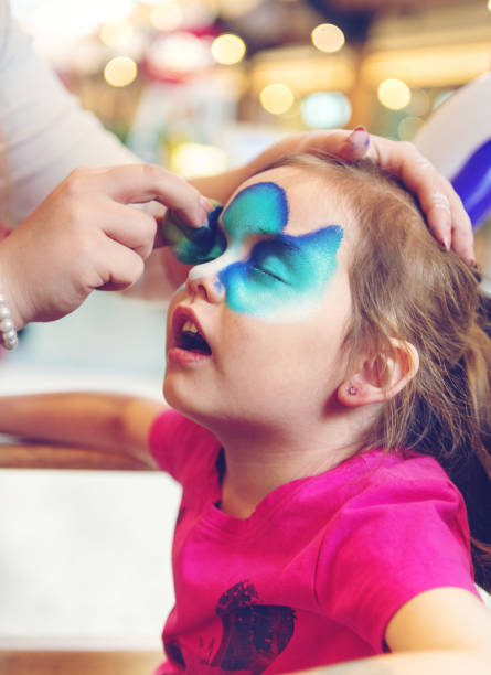 istock Little girl having a face paint 942238246