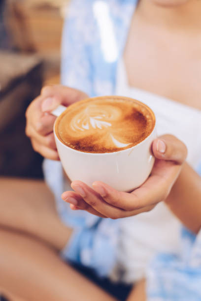 istock Closeup of female hands holding coffee 942238542