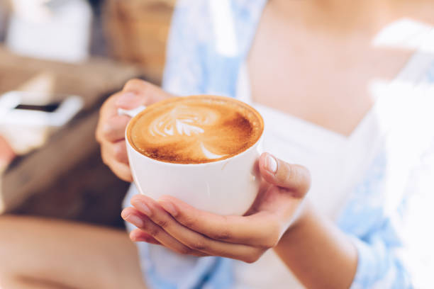 istock Closeup of female hands holding coffee 942238580