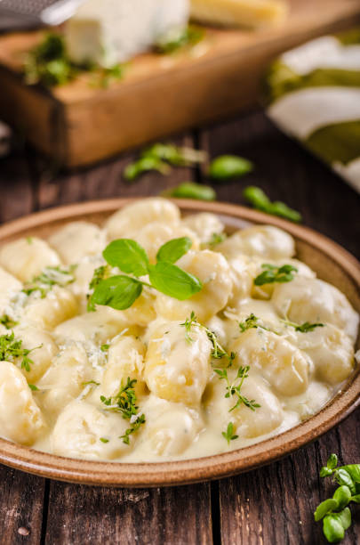istock Cheese gnocchi with blue cheese sauce and galic 942240886