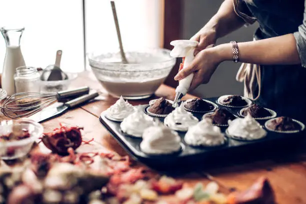 Young woman making puffy cookies