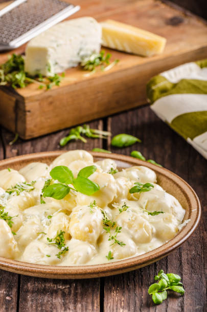 istock Cheese gnocchi with blue cheese sauce and galic 942241302