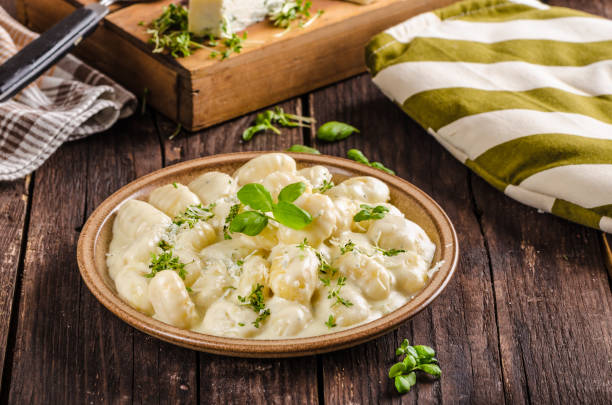 istock Cheese gnocchi with blue cheese sauce and galic 942241536