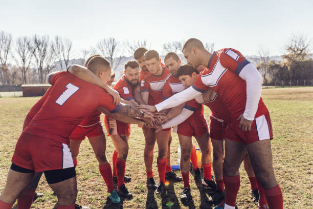 istock Group of rugby players huddling during time out 942242350