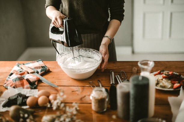 istock Young hous wife mixing wiped cream 942242512