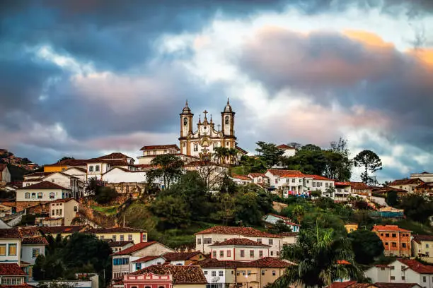 Sunset Over Hilltop Colonial Town (Ouro Preto, Minas Gerais, Brazil) with view of Historic Cathedral.