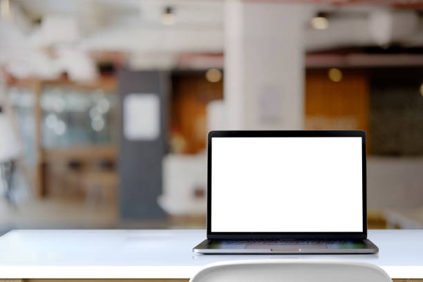istock Mock up laptop on desk in office. 942242880