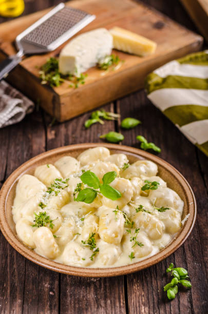 istock Cheese gnocchi with blue cheese sauce and galic 942243120