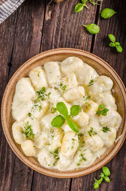 istock Cheese gnocchi with blue cheese sauce and galic 942243260