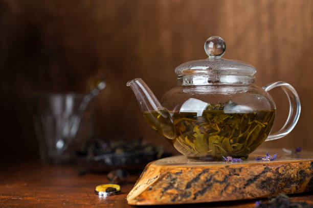 istock green tea in a glass teapot 942243308