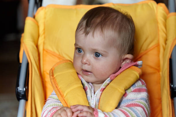 istock Surprised baby in the pram looking away 942243334