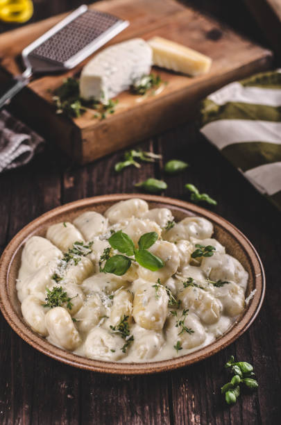 istock Cheese gnocchi with blue cheese sauce and galic 942247150