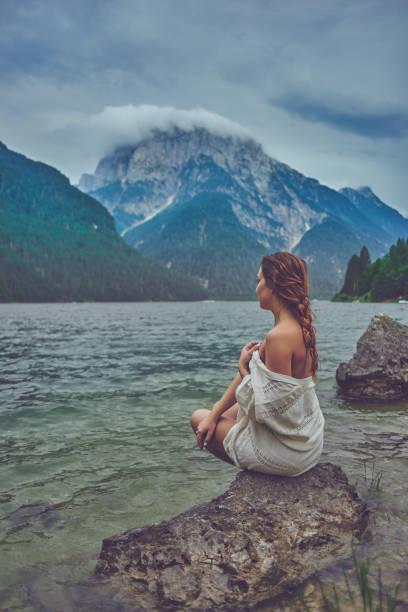 istock Lady at the lake 942247328