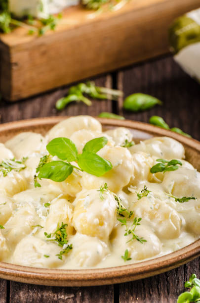 istock Cheese gnocchi with blue cheese sauce and galic 942248002