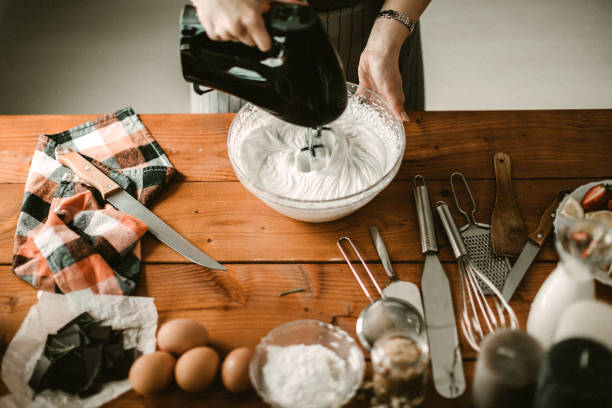 istock Young hous wife mixing wiped cream 942250178