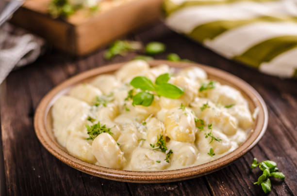istock Cheese gnocchi with blue cheese sauce and galic 942250428