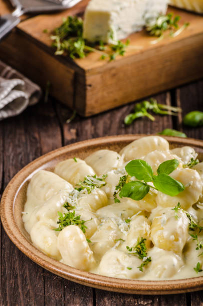 istock Cheese gnocchi with blue cheese sauce and galic 942250894