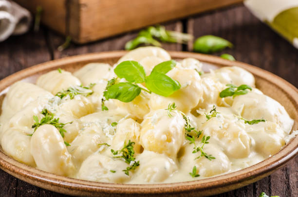 istock Cheese gnocchi with blue cheese sauce and galic 942251558
