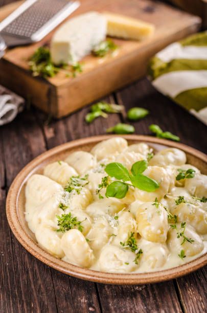 istock Cheese gnocchi with blue cheese sauce and galic 942252316