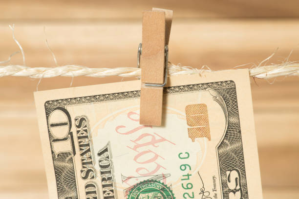 istock A $10 bill on a clothesline with clothespin 942255622