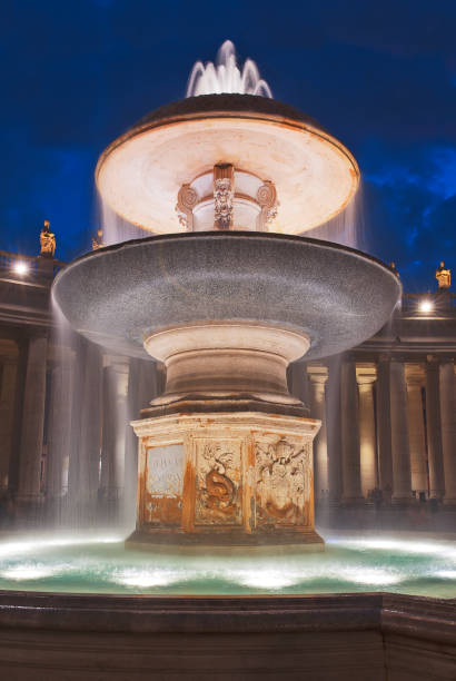 istock Vertical night time Vatican exterior fountain. 942261980