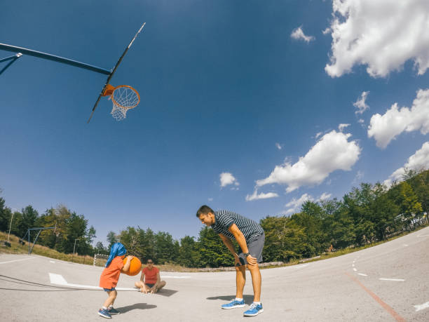 istock Family playing basketball 942265876