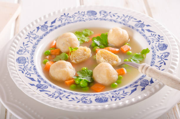 istock Spring chicken soup noodles, vegetable and toast 942265930