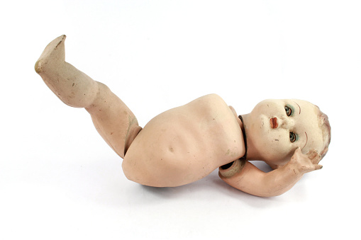 Close Up and Isolated Vintage Antique Old Doll