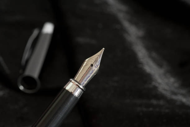 istock An elegant fountain pen on a black background 942271532