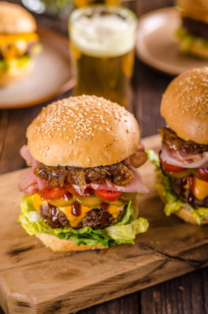 istock Homemade beef burger, caramelized onion, bacon and beer 942272358