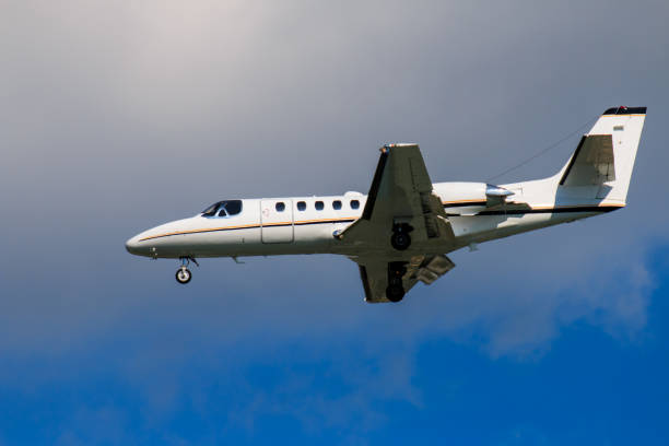 istock A small plane is flying in the sky 942283406