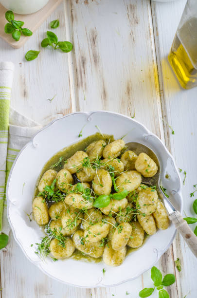 istock Pesto gnocchi, garlic and fresh herbs olive oil 942286784