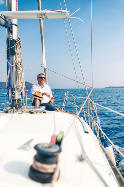 istock Man enjoying sailing with sailboat 942286790