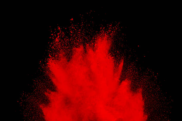 istock abstract red dust explosion on  black background. abstract red powder splattered on  background, Freeze motion of red powder splash. 942286988