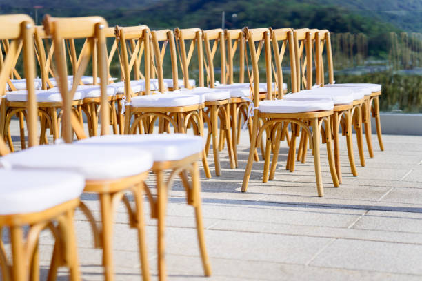 istock Folding lawn chairs setup for beach wedding - Side view with deph 942288224