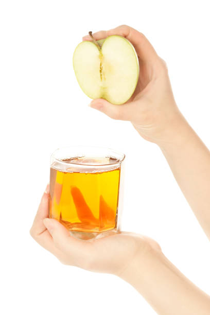 Woman's hands with apple fresh juice stock photo