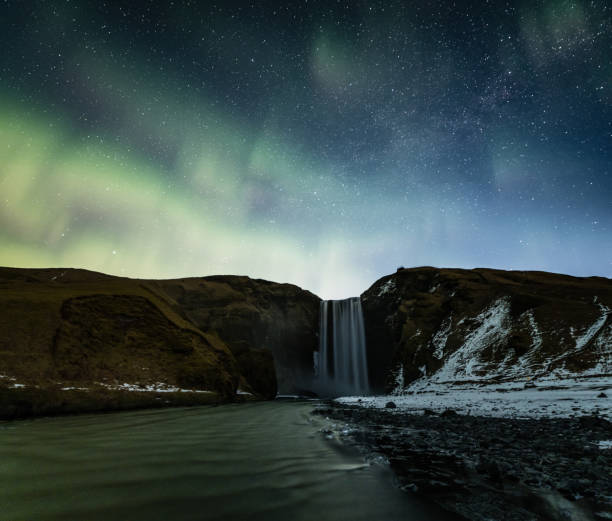 istock Northern lights over Skogafoss waterfall 942293626