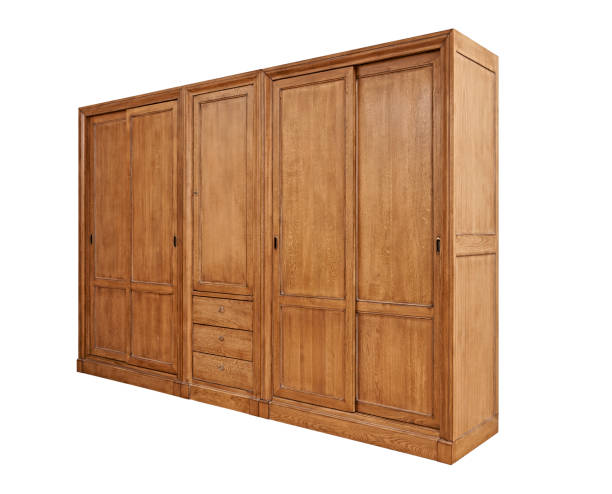 istock Closed classical wooden wardrobe isolated on white 942293676