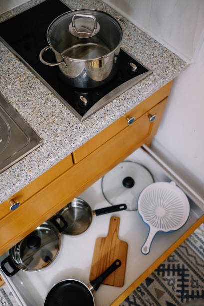 istock Pot on the stove and open box with kitchen utensils 942298082