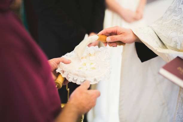 istock Wedding rings on ceremony at church. Macro 942300778