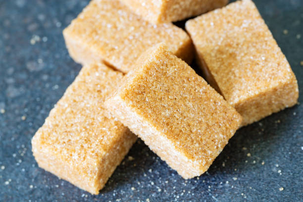 istock Heap of brown sugar, isolated on a vintage background 942300974