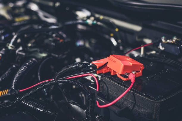istock Clese up battery charging cables transferring power to a dead battery 942301328