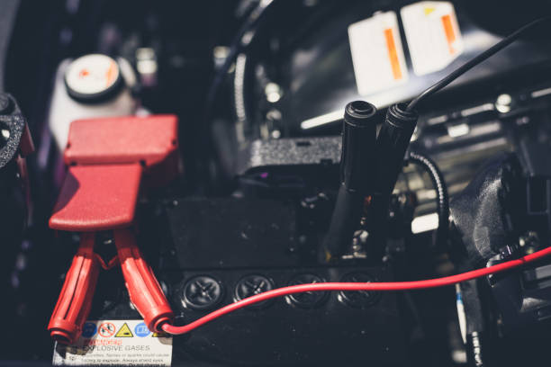 istock Clese up battery charging cables transferring power to a dead battery 942301854